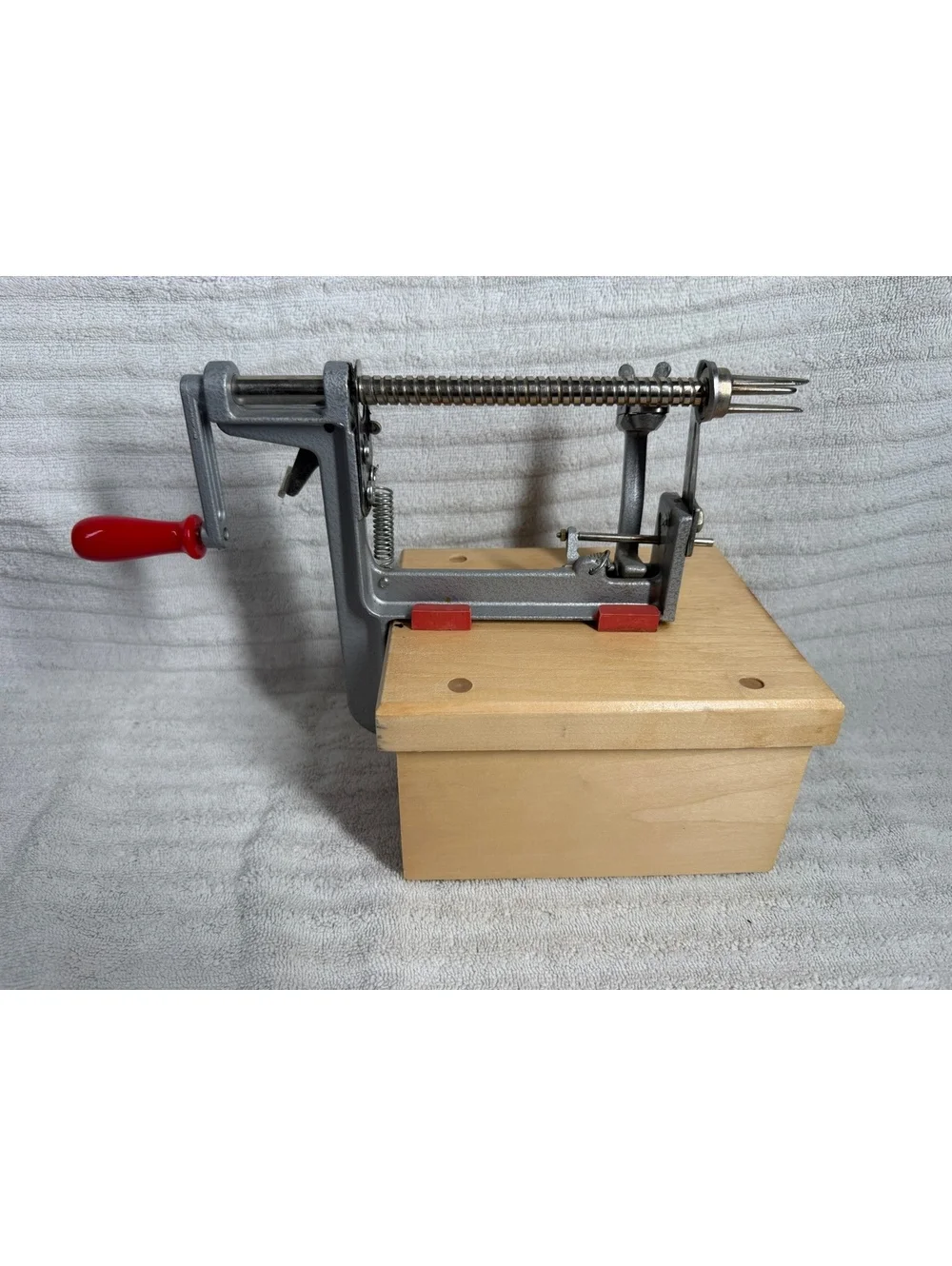 The Pampered Chef Apple Peeler with Wooden Base and Red Handle